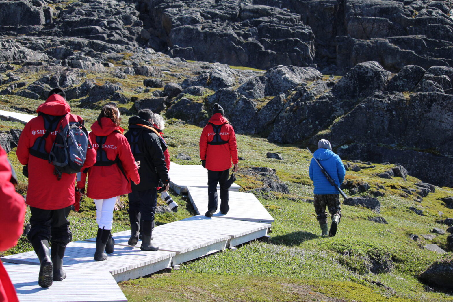 Passengers from the cruise ship Silver Endeavour tour Mallik Island in Kinngait, in summer 2024. Tourism operators discussed how to increase tourism benefits for Inuit during the 2025 Travel Nunavut conference and annual general meeting in Iqaluit. (File photo by Arty Sarkisian)